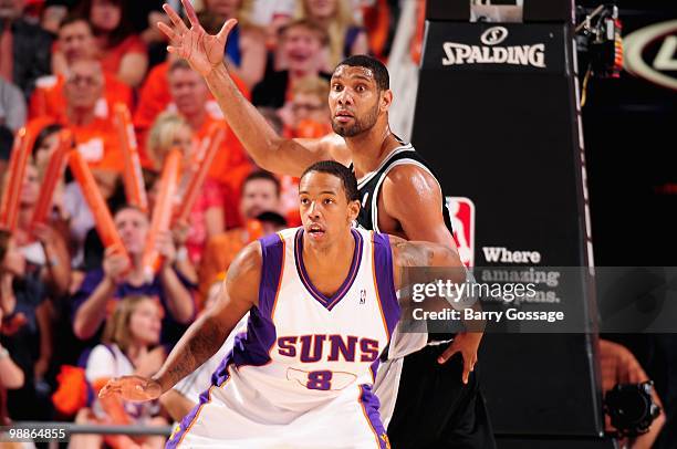 Channing Frye of the Phoenix Suns boxes out Tim Duncan of the San Antonio Spurs in Game One of the Western Conference Semifinals during the 2010 NBA...