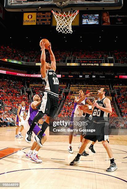 Keith Bogans of the San Antonio Spurs comes down with a rebound in Game One of the Western Conference Semifinals against the Phoenix Suns during the...
