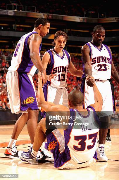 Channing Frye, Steve Nash and Jason Richardson help up teammate Grant Hill of the Phoenix Suns in Game One of the Western Conference Semifinals...
