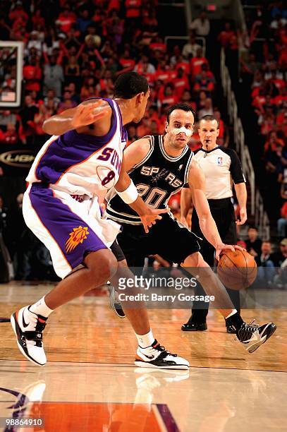 Manu Ginobili of the San Antonio Spurs goes up against Channing Frye of the Phoenix Suns in Game One of the Western Conference Semifinals during the...