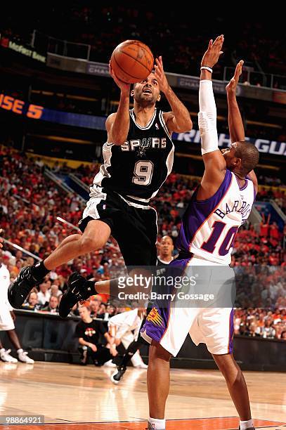 Tony Parker of the San Antonio Spurs goes up for a shot over Leandro Barbosa of the Phoenix Suns in Game One of the Western Conference Semifinals...