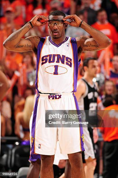 Amar'e Stoudemire of the Phoenix Suns adjusts his glasses in Game One of the Western Conference Semifinals against the San Antonio Spurs during the...