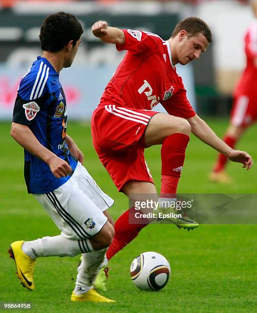 Oleksandr Aliyev of FC Lokomotiv Moscow battles for the ball with Emir Makhmudov of FC Saturn Moscow Oblast during the Russian Football League...