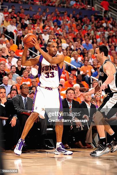 Grant Hill of the Phoenix Suns looks for an open pass over Manu Ginobili of the San Antonio Spurs in Game One of the Western Conference Semifinals...