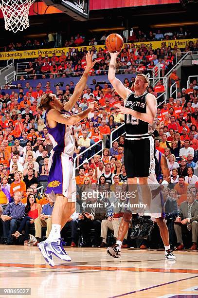Matt Bonner of the San Antonio Spurs goes up for a shot over Louis Amundson of the Phoenix Suns in Game One of the Western Conference Semifinals...