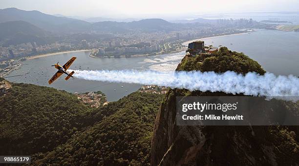 Matt Hall of Australia in action over Sugar Loaf Mountain during the Red Bull Air Race Day -4 at on May 5, 2010 in Rio de Janeiro, Brazil.