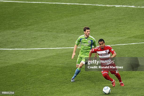 Midfielder David Ferreira of FC Dallas dribbles the ball against Brad Evans of the Seattle Sounders at Pizza Hut Park on April 22, 2010 in Frisco,...