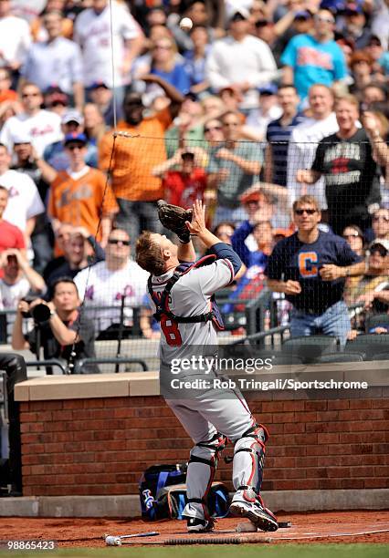 David Ross of the Atlanta Braves makes a catch of a fly ball against the New York Mets on April 24, 2010 at Citi Field in the Flushing neighborhood...