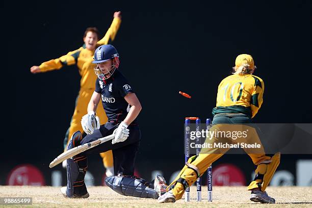 Beth Morgan of England is bowled by Shelley Nitschke during the ICC T20 Women's World Cup Group A match between England and Australia at Warner Park...