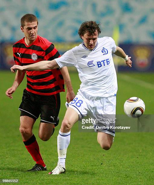 Edgaras Cesnauskis of FC Dynamo Moscow battles for the ball with Vitaliy Fedoriv of FC Amkar Perm during the Russian Football League Championship...
