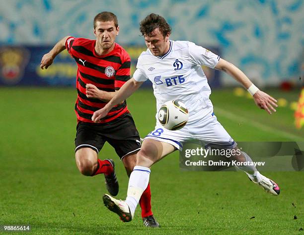 Edgaras Cesnauskis of FC Dynamo Moscow battles for the ball with Vitaliy Fedoriv of FC Amkar Perm during the Russian Football League Championship...