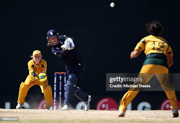 Sarah Taylor of England hits straight off the bowling of Lisa Sthalekar of Australia during the ICC T20 Women's World Cup Group A match between...