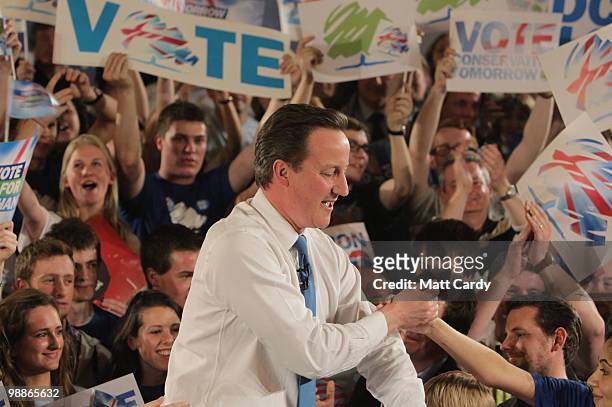 Conservative Party leader David Cameron greets supporters at a party rally at the end of his 24hr campaign stint on May 5, 2010 in Bristol, United...