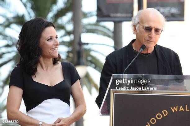 Julia Louis-Dreyfus and Larry David attend Julia Louis-Dreyfus' induction into the Hollywood Walk of Fame on May 4, 2010 in Hollywood, California.