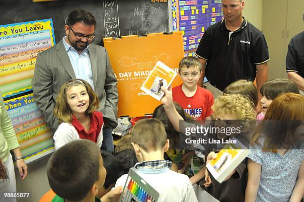 Students of Harry S. Truman School look at the donation box of $1000 in OfficeMax Supplies to Allentown, PA teacher Ms. Mary Beth Bedics by author...