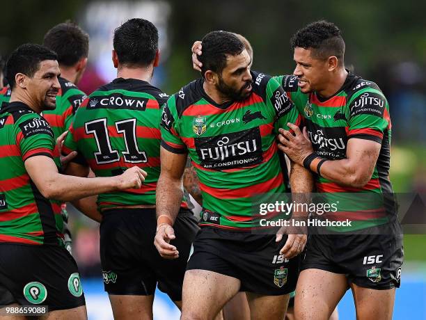 Dane Gagai of the Rabbitohs congratulates Greg Inglis of the Rabbitohs after he forced a Cowboys error during the round 16 NRL match between the...