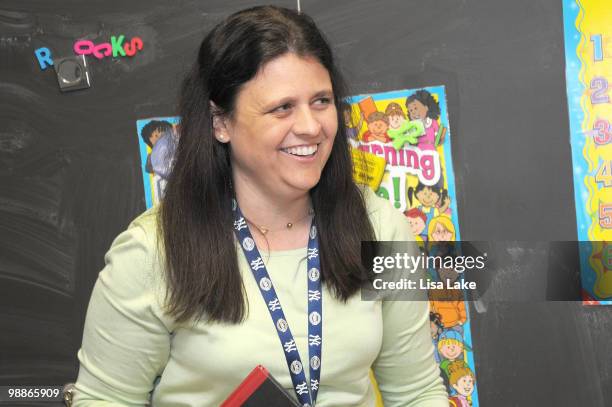 Elementary school teacher Ms. Mary Beth Bedics recipient of $1000 donation in OfficeMax Supplies by author Eric Wight and OfficeMax at Harry S Truman...