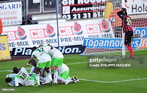 Saint-Etienne's forward Emmanuel Riviere is congratuled by teammates after scoring a goal during the French L1 football match Boulogne-sur-Mer vs...
