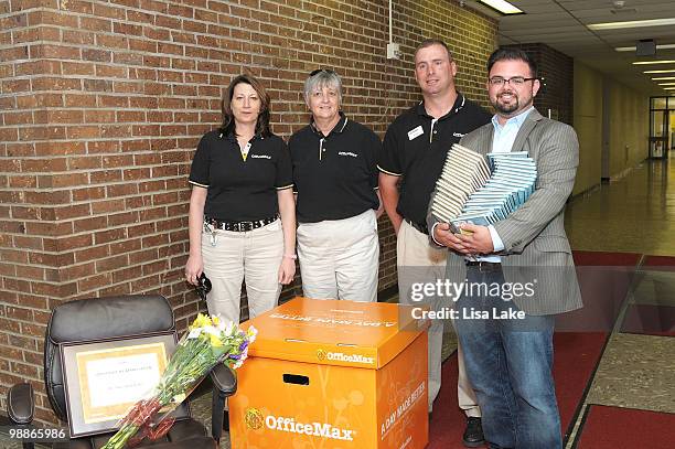 Office Max representatives and author Eric Wight surprise elementary school teacher Ms. Mary Beth Bedics with $1000 donation at Harry S Truman...