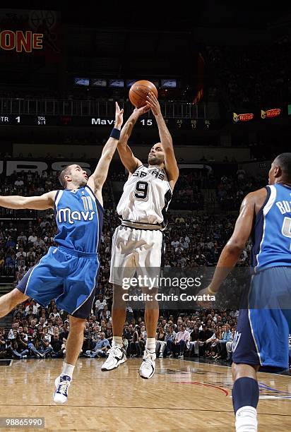 Tony Parker of the San Antonio Spurs shoots a jump shot against Jose Barea of the Dallas Mavericks in Game Four of the Western Conference...