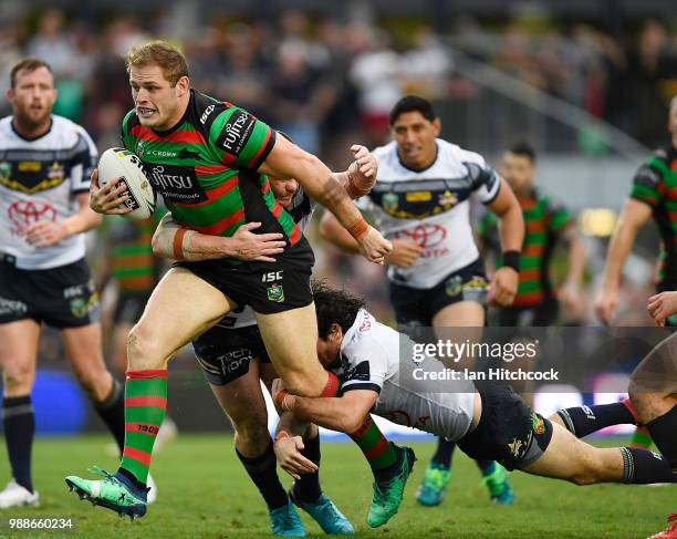 Tom Burgess of the Rabbitohs runs the ball during the round 16 NRL match between the South Sydney Rabbitohs and the North Queensland Cowboys at...