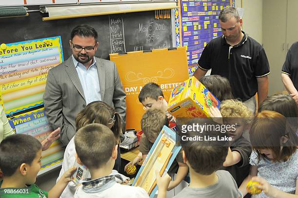 Students of Harry S. Truman School and author Eric Wight look at the donation box of $1000 in OfficeMax Supplies to Allentown, PA teacher Ms. Mary...