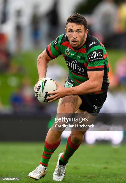 Sam Burgess of the Rabbitohs runs the ball during the round 16 NRL match between the South Sydney Rabbitohs and the North Queensland Cowboys at...