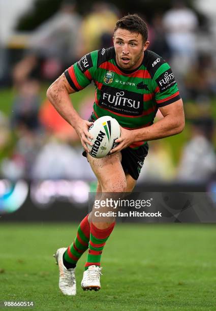 Sam Burgess of the Rabbitohs runs the ball during the round 16 NRL match between the South Sydney Rabbitohs and the North Queensland Cowboys at...
