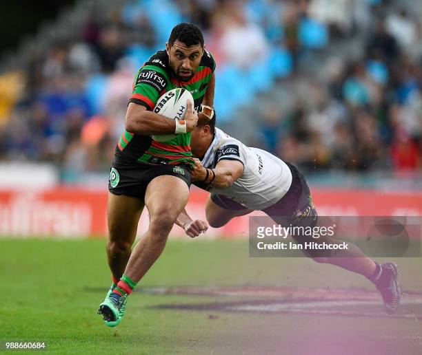 Alex Johnston of the Rabbitohs attempts to get past Kyle Feldt of the Cowboys during the round 16 NRL match between the South Sydney Rabbitohs and...