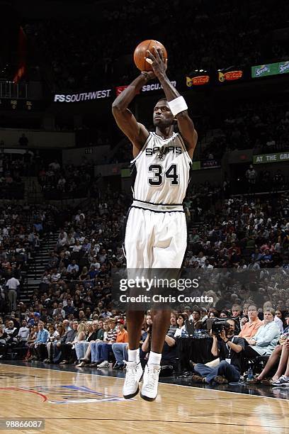 Antonio McDyess of the San Antonio Spurs shoots a jump shot against the Dallas Mavericks in Game Four of the Western Conference Quarterfinals during...