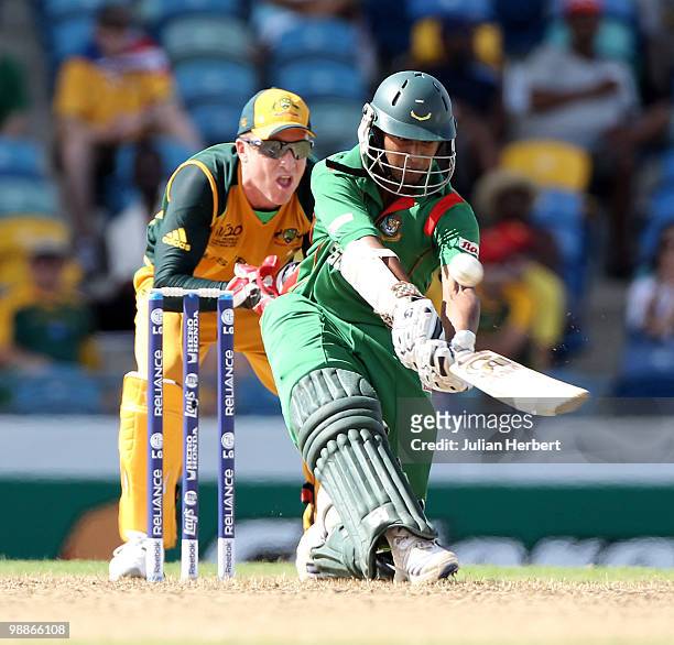 Mushfiqur Rahim of Bangladesh scores runs as Brad Haddin looks on during The ICC World Twenty20 Group A Match between Bangladesh and Australia played...