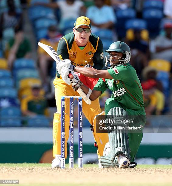 Mushfiqur Rahim of Bangladesh scores runs as Brad Haddin looks on during The ICC World Twenty20 Group A Match between Bangladesh and Australia played...