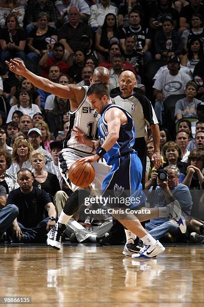 Jose Barea of the Dallas Mavericks drives to the basket against Keith Bogans of the San Antonio Spurs in Game Four of the Western Conference...