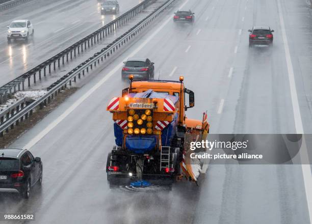 Gritting and snow clearing vehicle in falling snow on the Autobahn A8 motorway between Munich and Salzburg in Irschenberg, Germany, 08 December 2017....