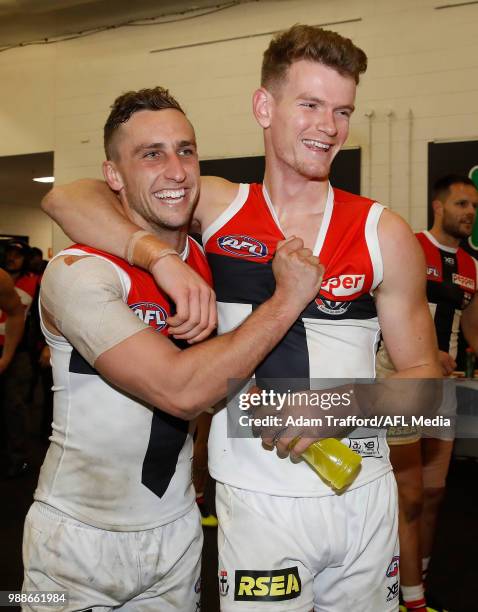 Luke Dunstan of the Saints celebrates with Debutant, Darragh Joyce of the Saints during the 2018 AFL round 15 match between the Melbourne Demons and...