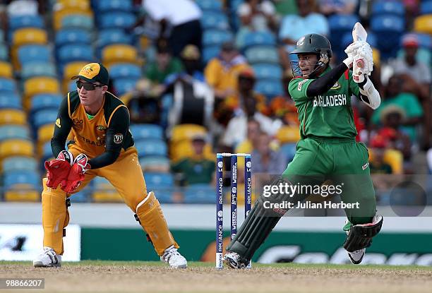 Mushfiqur Rahim of Bangladesh scores runs as Brad Haddin looks on during The ICC World Twenty20 Group A Match between Bangladesh and Australia played...