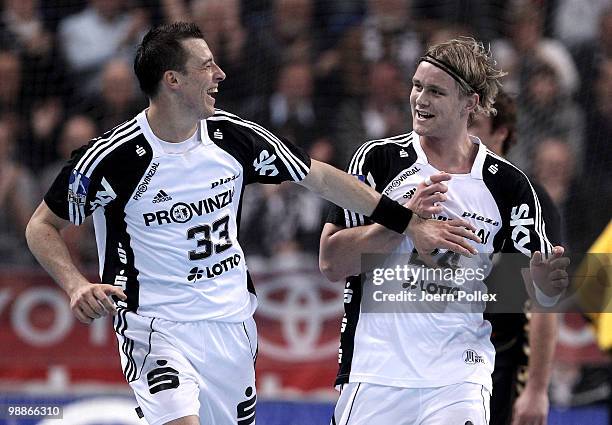 Aron Palarsson of Kiel celebrates with his team mate Dominik Klein after scoring a goal during the Toyota Handball Bundesliga match between THW Kiel...
