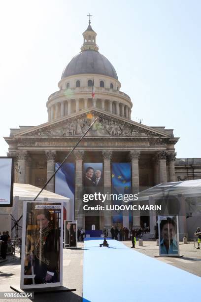 Photos of the late politician Simone Veil and her husband Antoine Veil are seen outside and at the entrance of the Pantheon in Paris on July 1, 2018...