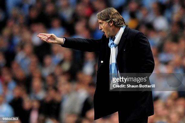 Manchester City Manager Roberto Mancini issues instructions during the Barclays Premier League match between Manchester City and Tottenham Hotspur at...