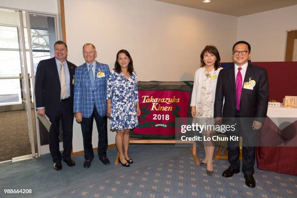 William Nader and connections of Werther, trainer John Moore, his wife FiFi Moore, owner Johnson Chen and his wife at Hanshin Racecourse on June 24,...