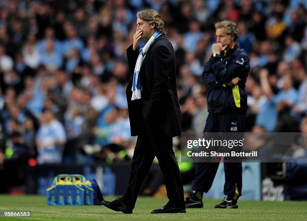 Manchester City Manager Roberto Mancini watches pensively during the Barclays Premier League match between Manchester City and Tottenham Hotspur at...