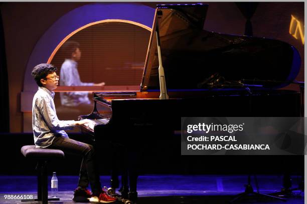 Fifteen-year-old Indonesian prodigy jazz pianist Joey Alexander performs on June 30, 2018 in Ajaccio during the International Jazz Festival on the...