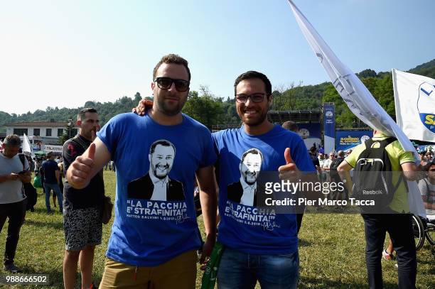 Two supporters of the Northern League pose with Matteo Salvini's T-shirt at the Lega Nord Meeting on July 1, 2018 in Pontida, Bergamo, Italy.The...