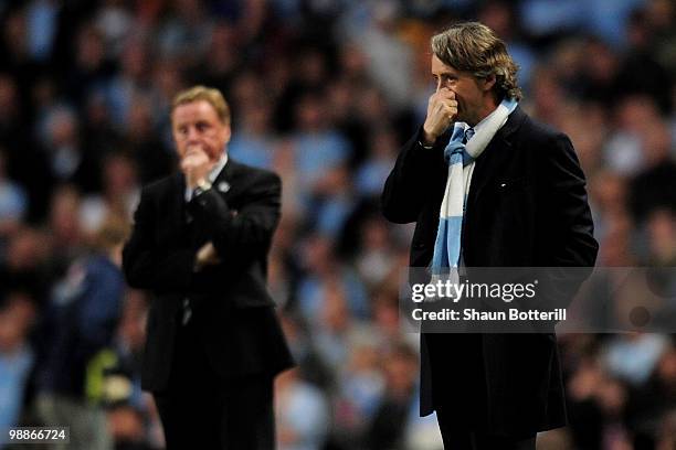 Manchester City Manager Roberto Mancini watches pensively during the Barclays Premier League match between Manchester City and Tottenham Hotspur at...