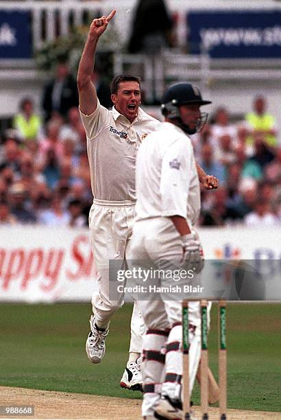 Glenn McGrath of Australia celebrates the early wicket of Michael Atherton of England during the first day of the Npower Third Test match between...