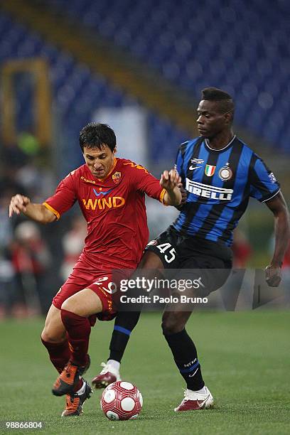 Mario Balotelli of FC Internazionale Milano and Nicolas Burdisso of AS Roma in action during the Tim Cup between FC Internazionale Milano and AS Roma...