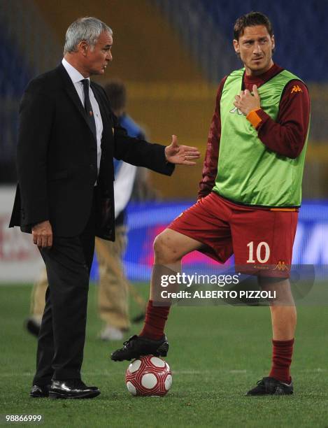 Roma coach Claudio Ranieri talks with AS Roma's forward Francesco Totti during the pause of the Coppa Italia final against Inter Milan on May 5, 2010...