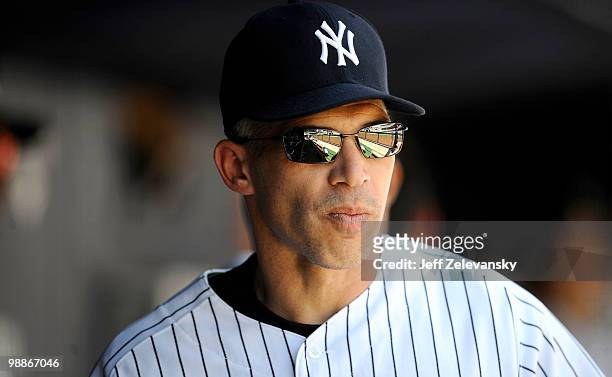 Joe Girardi of the New York Yankees walks in the dugout against the Baltimore Orioles at Yankee Stadium on May 5, 2010 in the Bronx borough of New...