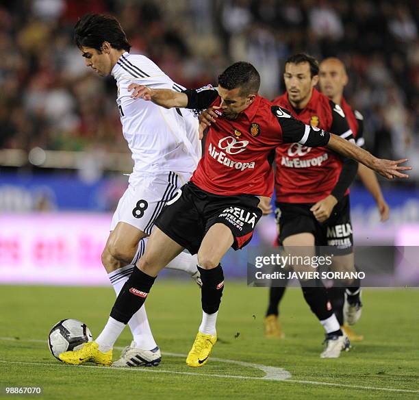 Real Madrid's Brazilian midfielder Kaka fights for the ball against Mallorca's midfielder Julio Alvarez during their Spanish League football match...