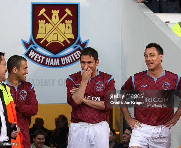 Joe Cole, Frank Lampard and John Terry share a joke ahead of their introduction during the Tony Carr Testimonial match between the Academy All-Stars...